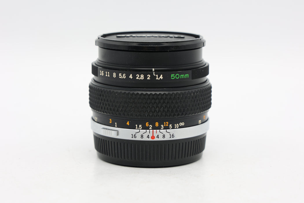 Used Olympus OM 50mm f1.4 (Fair) Light Cement Separation